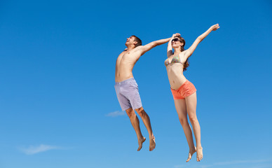 Happy Young Couple Together On The Beach