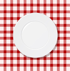 White plate on tablecloth