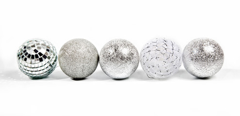 Five different silver new year balls