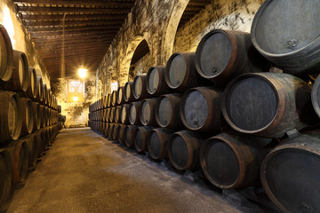 Old wine celler with wooden barrels