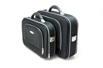 Two black suitcases - vacation baggage - isolated