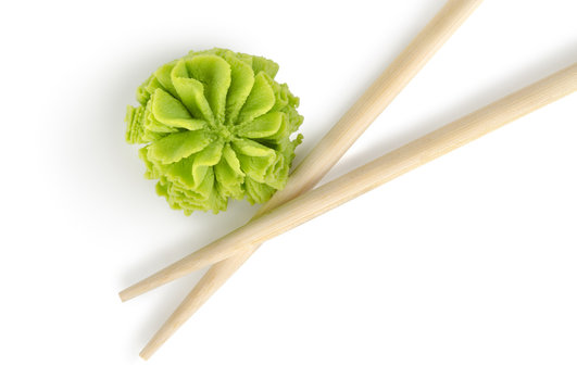 Wooden chopsticks and wasabi isolated