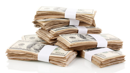 Stacks of one hundred dollars banknotes close-up isolated