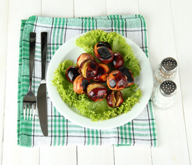 roasted chestnuts with lettuce in the plate