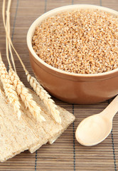 Brown bowl full of wheat bran