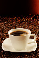 Composition with white cup of coffee