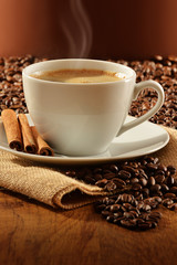 Composition with white cup of coffee