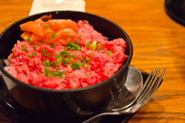 Toro Donburi in the black bowl. (45 depression angle)