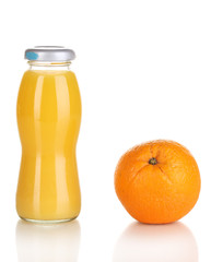 Delicious orange juice in a bottle and orange next to it