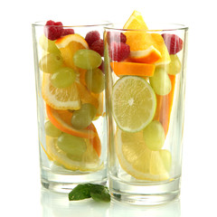 transparent glasses with citrus fruits, isolated on white