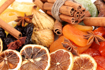 Dried fruits with cinnamon and star anise close-up