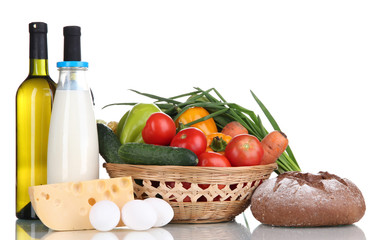 Composition with vegetables  in wicker basket isolated on white