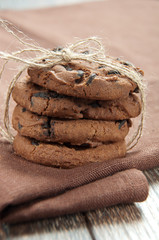 Pile of delicious chocolate chip cookies on table