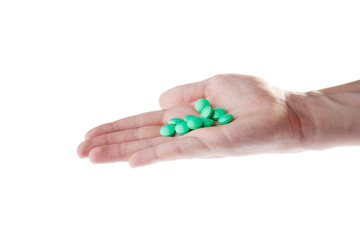 Hands with pills isolated on white background