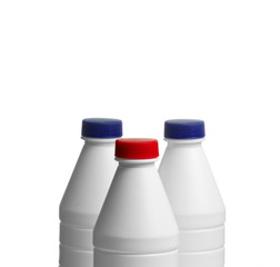 bottle of milk with a caps colored isolated on white background