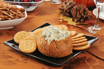 Spinach artichoke dip on a holiday table
