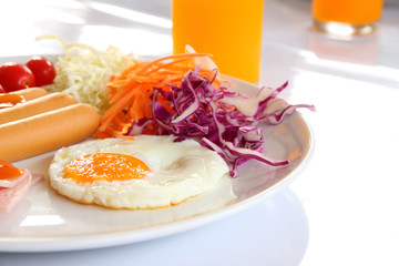 Breakfast meal focus center fried egg.