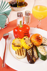 Grilled vegetables on a laid table
