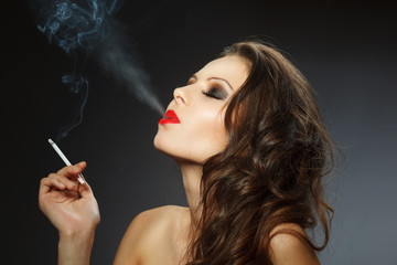 young brunette woman with cigarette