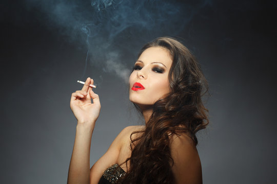 young brunette woman with cigarette