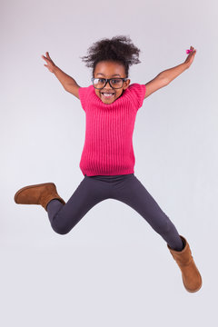 Portrait Of Young African American Girl Jumping