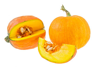 Fresh yellow pumpkins with cut-off piece.