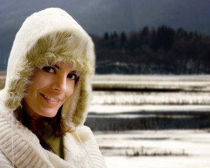 winter girl against snowy landscape