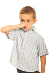 Boy  holding his nose