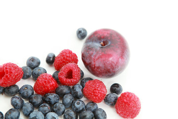 fresh raspberries, blueberries and plum