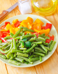 Fresh raw vegetables in the green plate