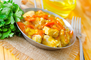 chicken with vegetable in metal plate