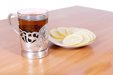 hot tea in a retro glass on the table