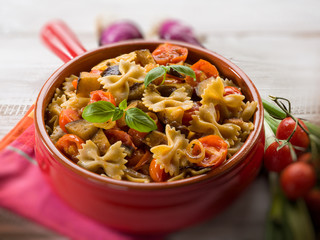 pasta with eggplants and pachino tomatoes, selective focus