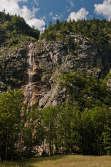 Waterfall falling from slope rocks