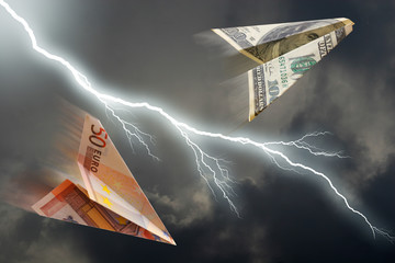 business concept. euro and dollar plane and  thunderstorm