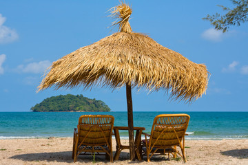 Sun loungers with an umbrella on the beach