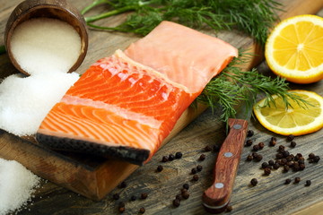 Fresh salmon with dill and lemon slice.