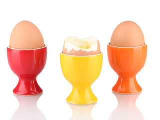 boiled egg in egg cup isolated on white