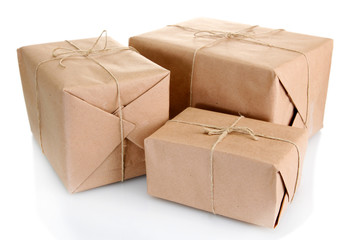 parcels boxes with kraft paper, isolated on white