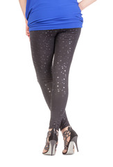 Sexy stylish legs in shimmering black leggins