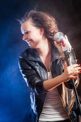 Laughing young singer on the stage