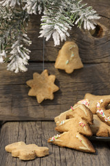 Christmas homemade cookies on wooden boards with fir background