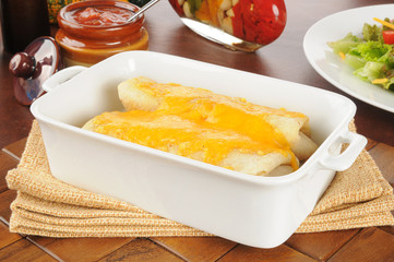 Burritos with melted cheddar cheese