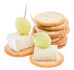 Crackers with Camembert on white