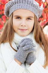 Child girl in winter clothes