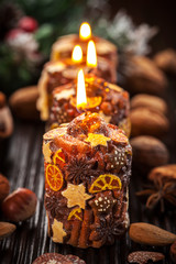 Rustic Christmas candles with spices and  nuts