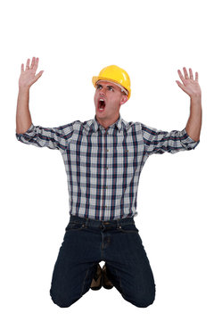 Laborer Sitting On His Knees Screaming