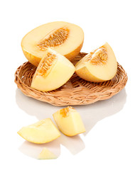 Ripe melons on wicker cradle isolated on white