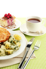 Roast chicken cutlet with boiled potatoes and  vegetables, cup