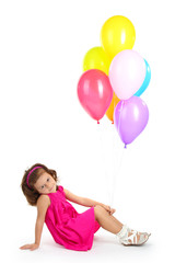 Fototapeta na wymiar piękna dziewczynka z balonami na białym